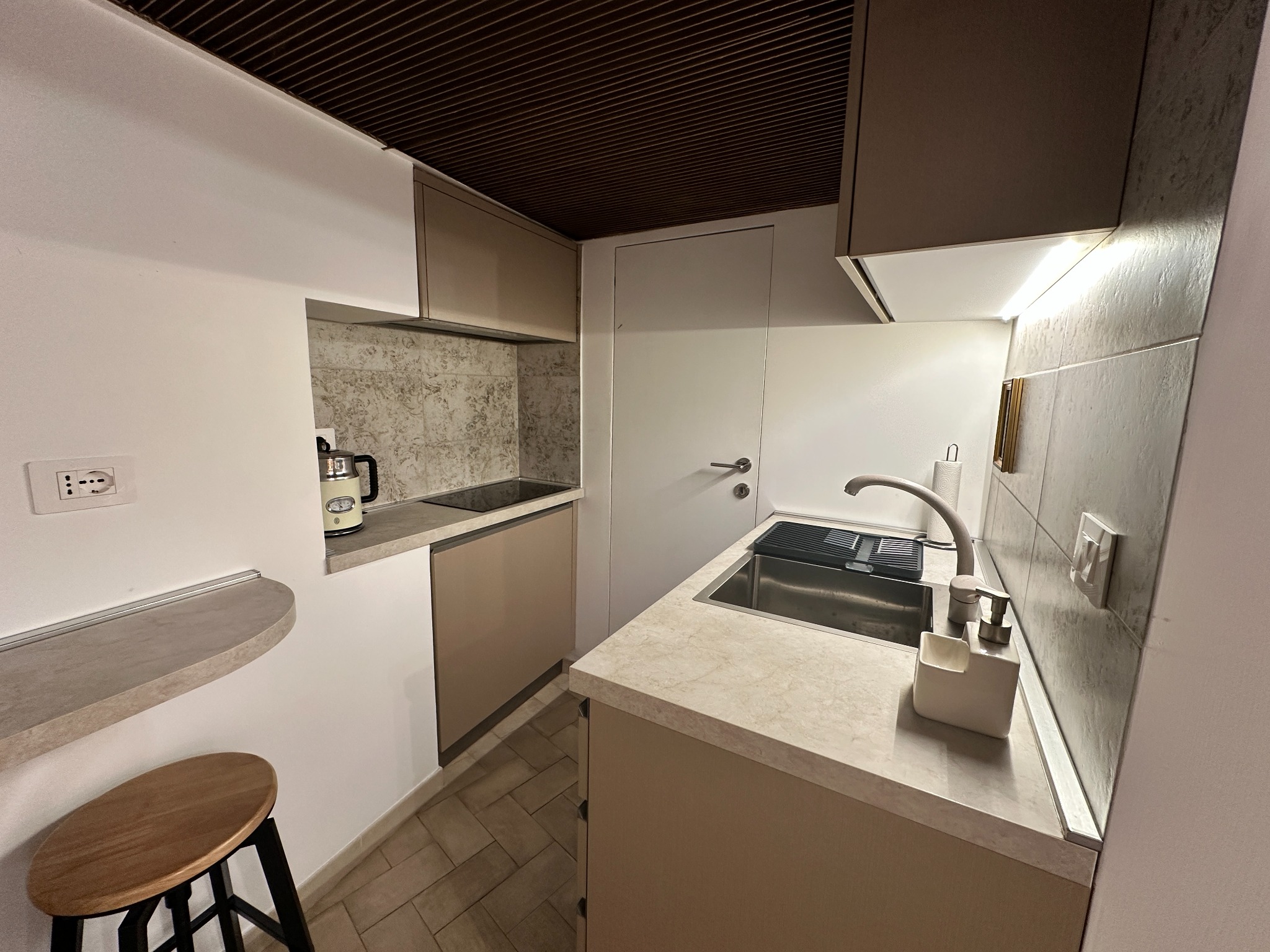 Kitchen and mezzanine staircase at Cortile Decorus