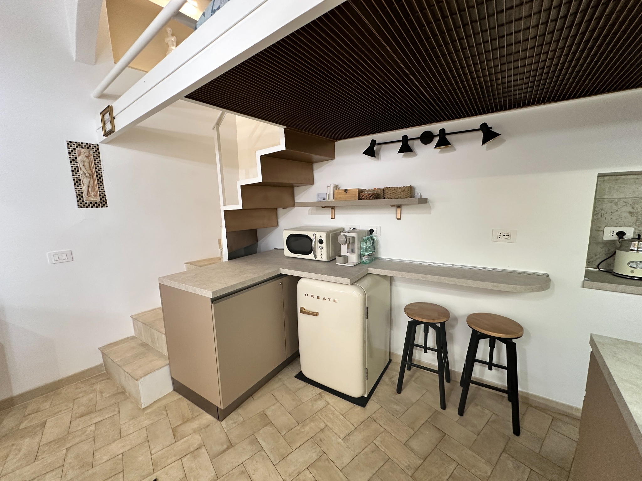 Kitchen with induction hob, refrigerator and dishwasher